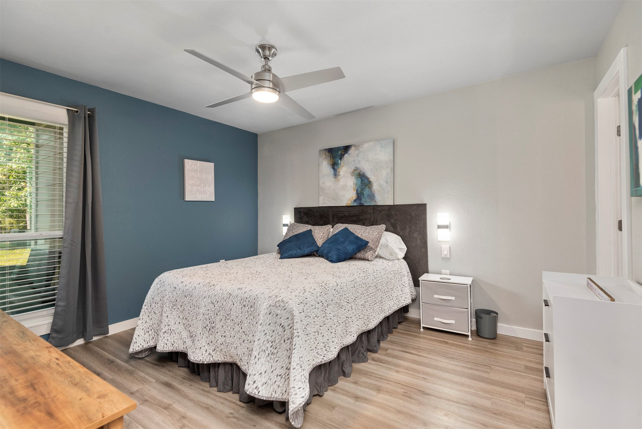 13151 Walden Road, Unit 195 Montgomery, TX 77356 - Photo 14 of 35 a bedroom with a bed and a chandelier