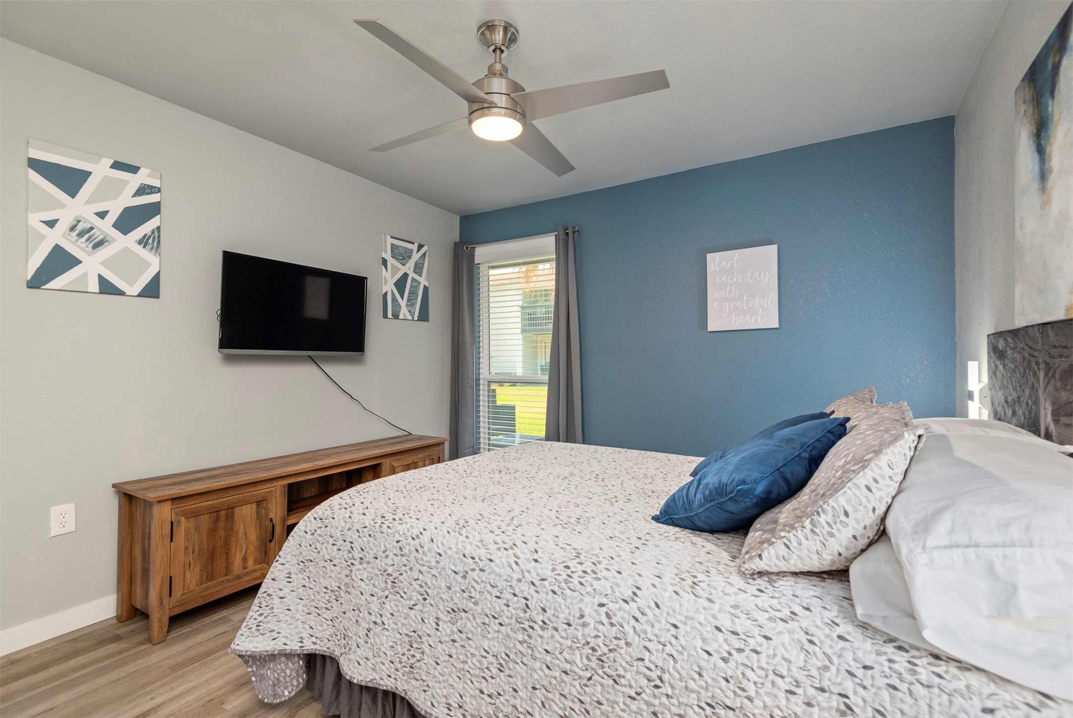 13151 Walden Road, Unit 195 Montgomery, TX 77356 - Photo 20 of 35 a bedroom with a bed and a flat screen tv