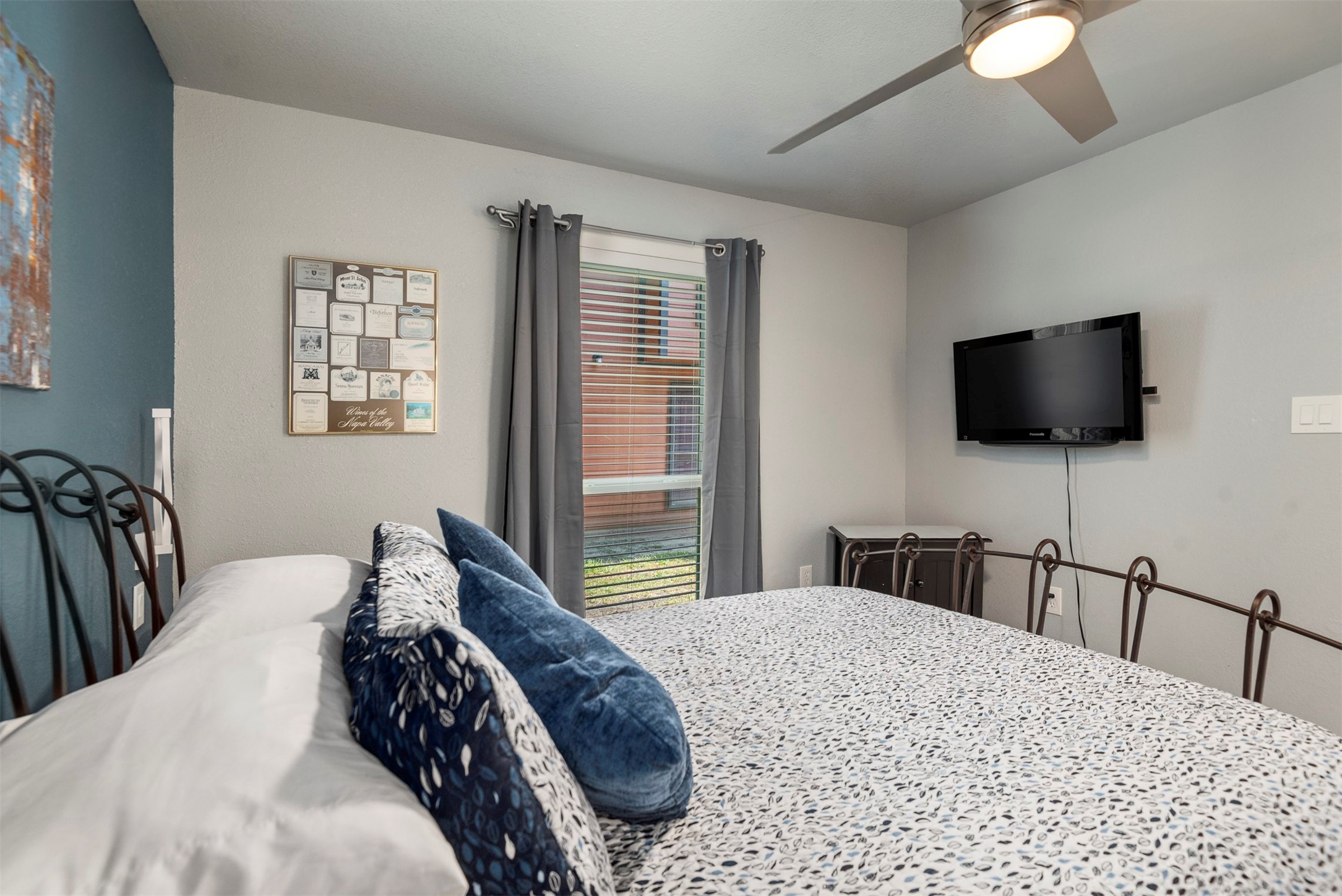 13151 Walden Road, Unit 195 Montgomery, TX 77356 - Photo 26 of 35 a bedroom with a bed and a flat screen tv