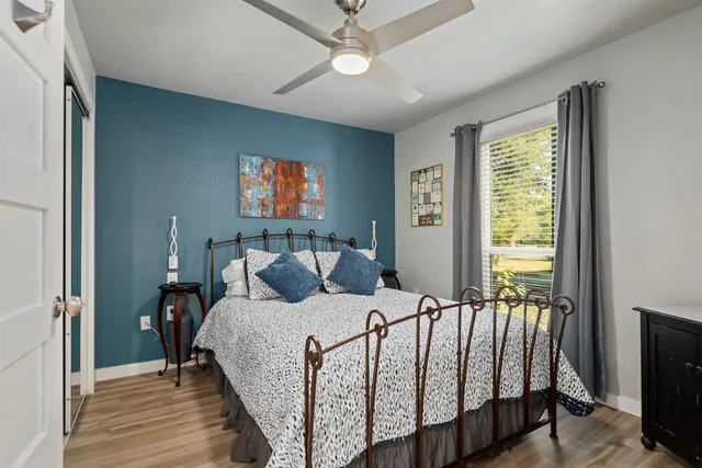 a bedroom with a bed and a window