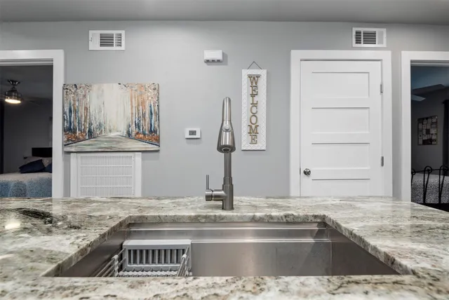a view of a kitchen counter top space and cabinets