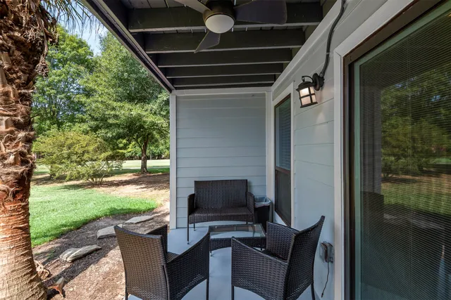 a outdoor living space with patio furniture and a garden