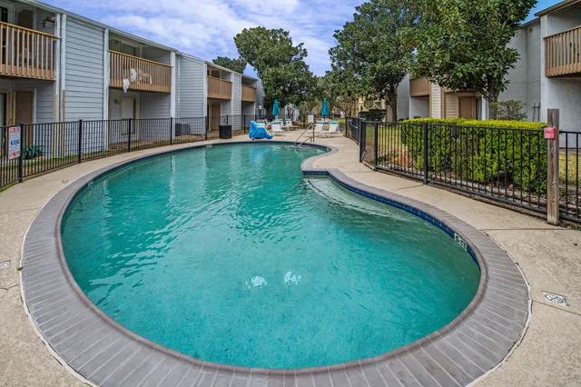 a view of a swimming pool with a garden