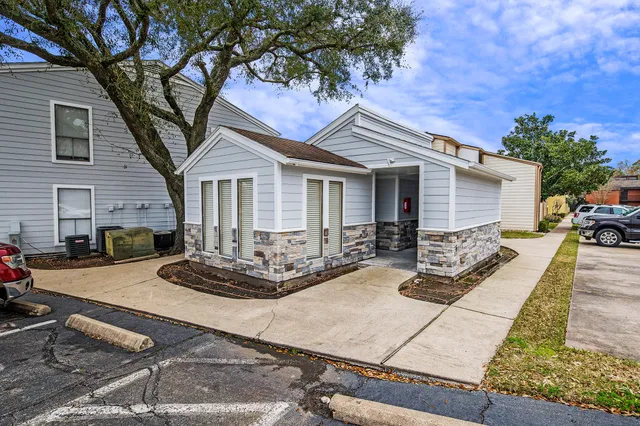 a front view of house with yard outdoor seating and barbeque oven