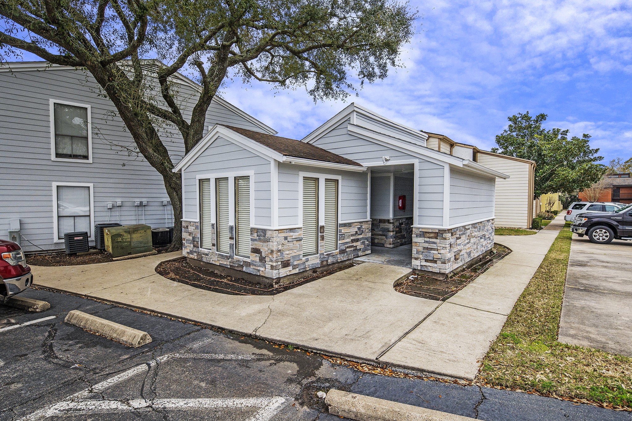 13151 Walden Road, Unit 195 Montgomery, TX 77356 - Photo 35 of 35 a front view of house with yard outdoor seating and barbeque oven