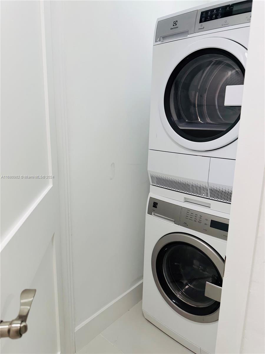 345 Ocean Drive, Unit 219 Miami Beach, FL 33139 - Photo 19 of 26 a utility room with dryer and washer