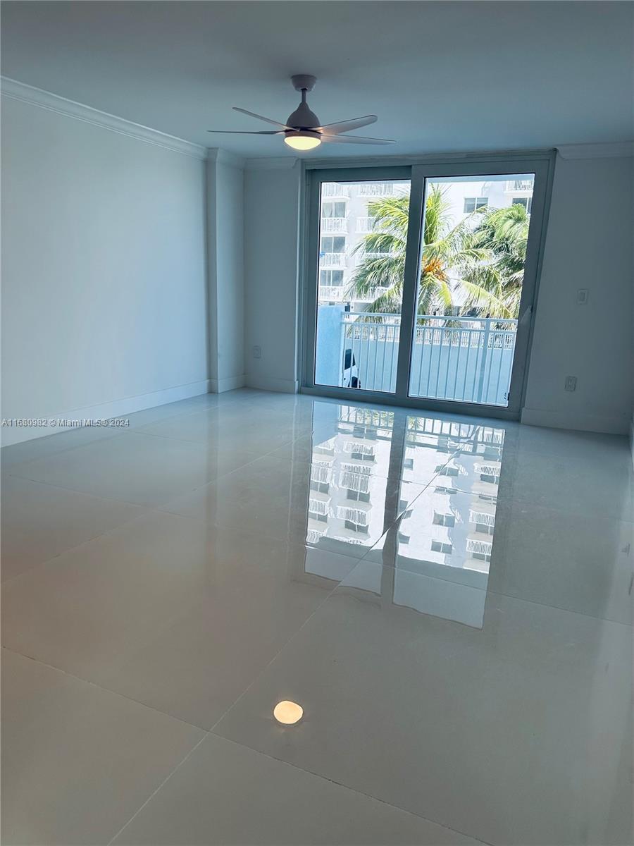 345 Ocean Drive, Unit 219 Miami Beach, FL 33139 - Photo 7 of 26 an empty room with windows