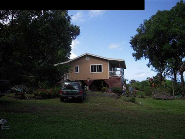 377 Ulaino Road, Unit KAWELA RIDGE LOT 7 Hana, HI 96713 - Photo 13 of 30 a front view of a house with a garden