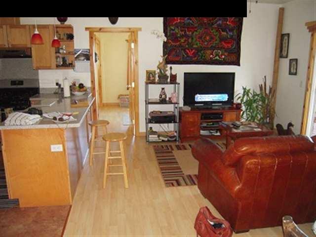 377 Ulaino Road, Unit KAWELA RIDGE LOT 7 Hana, HI 96713 - Photo 15 of 30 a living room with furniture a flat screen tv and a fireplace
