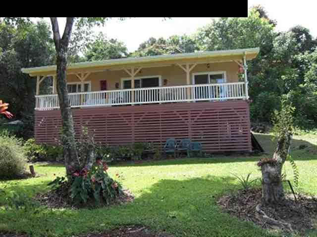 377 Ulaino Road, Unit KAWELA RIDGE LOT 7 Hana, HI 96713 - Photo 8 of 30 a view of a house with a yard and a large tree