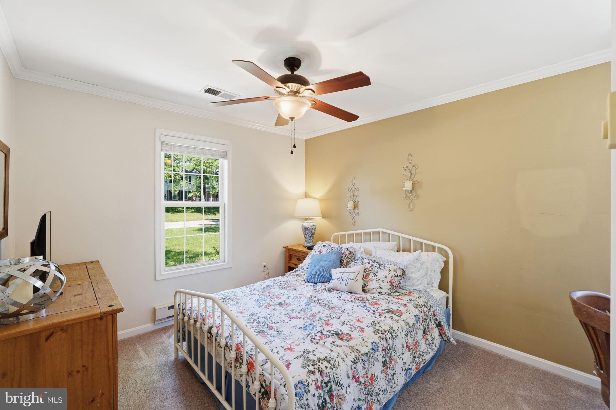 19608 Gott Street Poolesville, MD 20837 - Photo 27 of 43 a bedroom with a bed and a window
