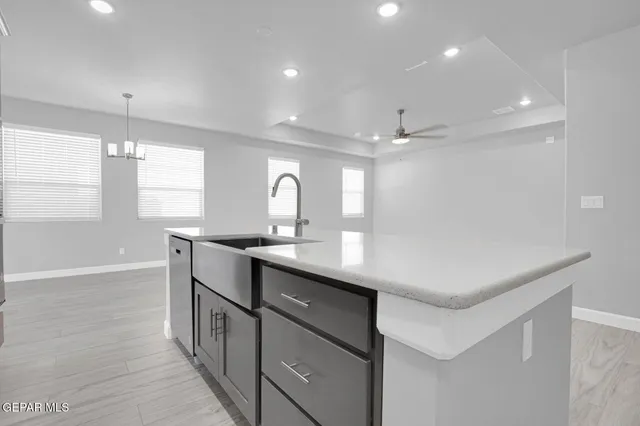 a kitchen with counter top space and sink
