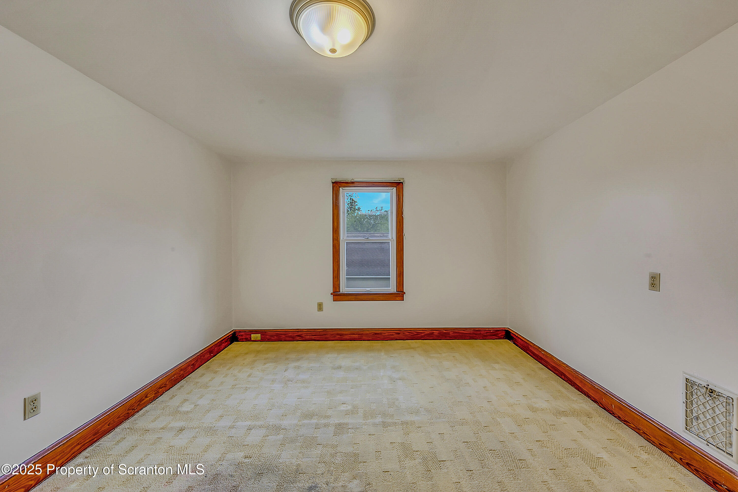 443 14th Avenue, Unit REAR Scranton, PA 18504 - Photo 13 of 16 an empty room with a window