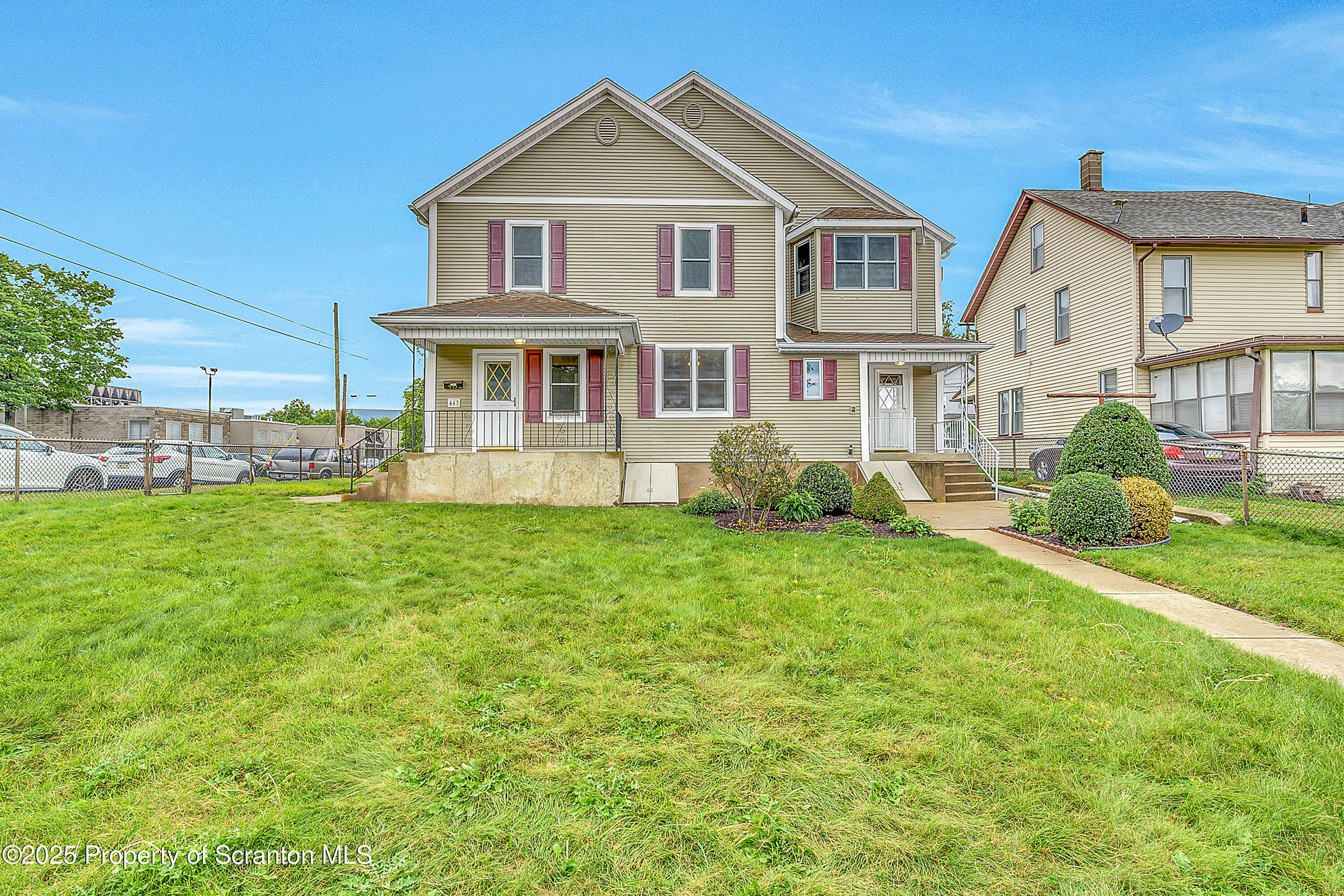 443 14th Avenue, Unit REAR Scranton, PA 18504 - Photo 15 of 16 a front view of a house with garden