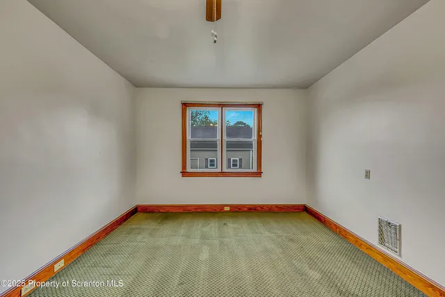 a bathroom with a toilet sink vanity tub and shower