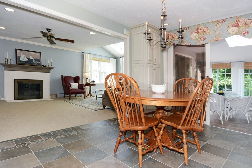 19 Lanthorn Road Northborough, MA 01532 - Photo 13 of 30 a dining room with furniture a fireplace and chandelier