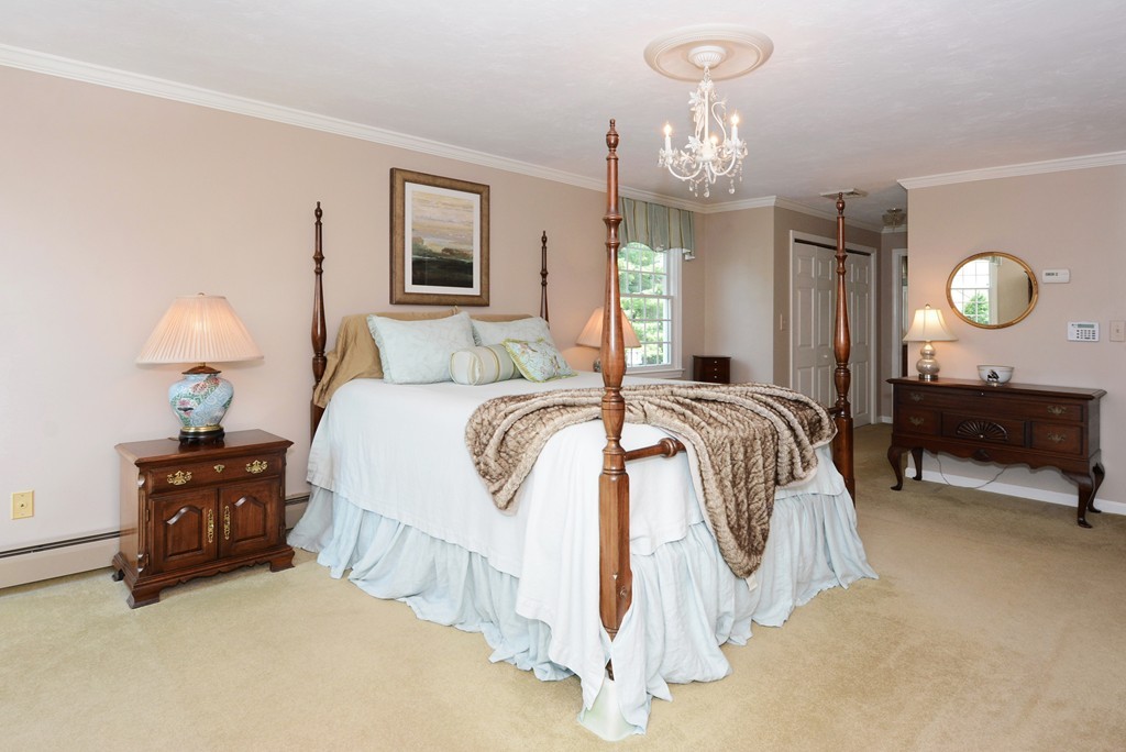 19 Lanthorn Road Northborough, MA 01532 - Photo 17 of 30 a bedroom with bed and a chandelier