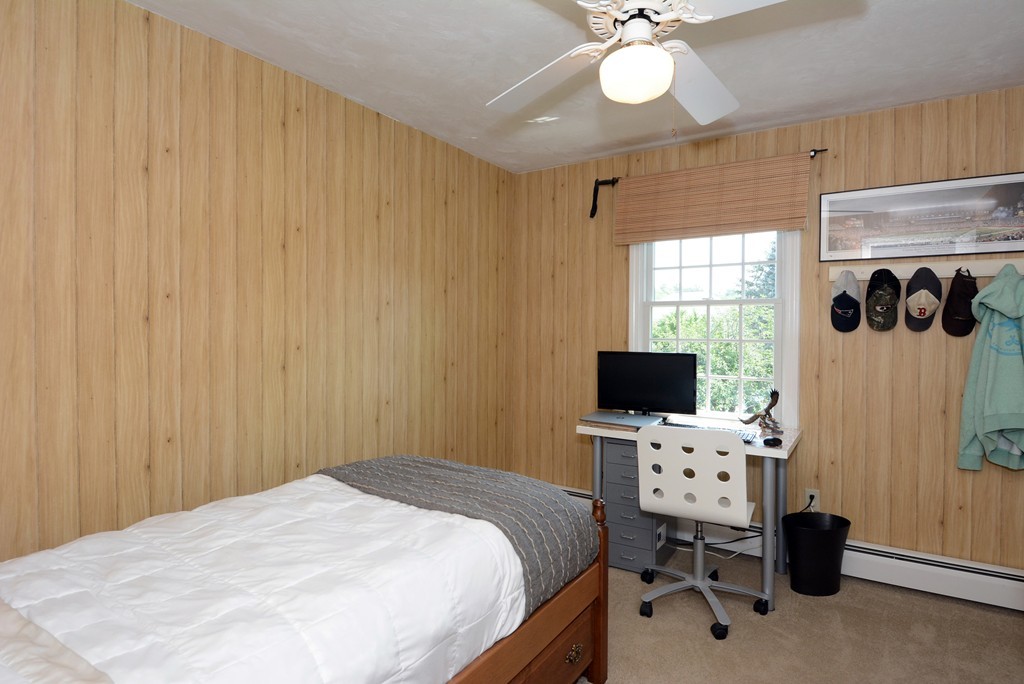 19 Lanthorn Road Northborough, MA 01532 - Photo 21 of 30 a bedroom with a bed and a flat screen tv