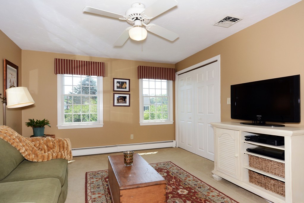 19 Lanthorn Road Northborough, MA 01532 - Photo 24 of 30 a living room with furniture and a flat screen tv