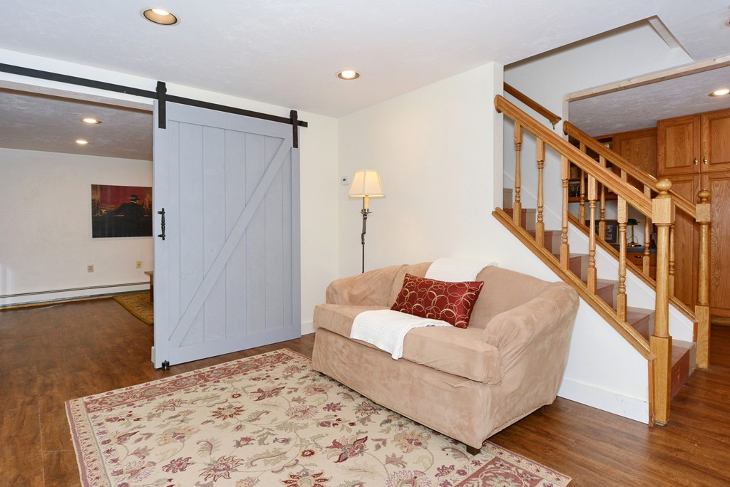 19 Lanthorn Road Northborough, MA 01532 - Photo 25 of 30 a living room with furniture and a rug