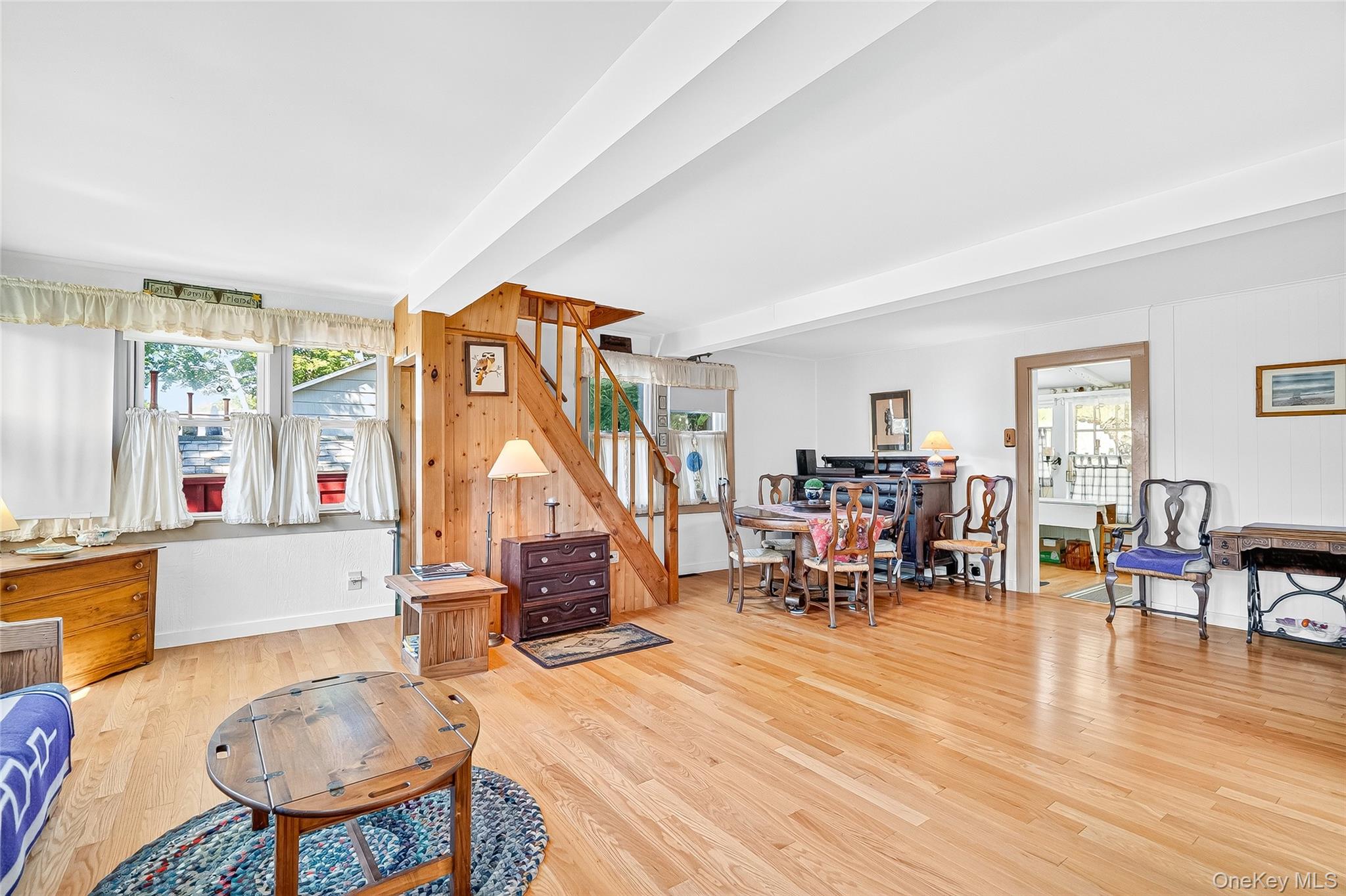 5 Orchard Road North Salem, NY 10509 - Photo 11 of 47 Living room with light wood-type flooring, beamed ceiling, wood walls, and stairs