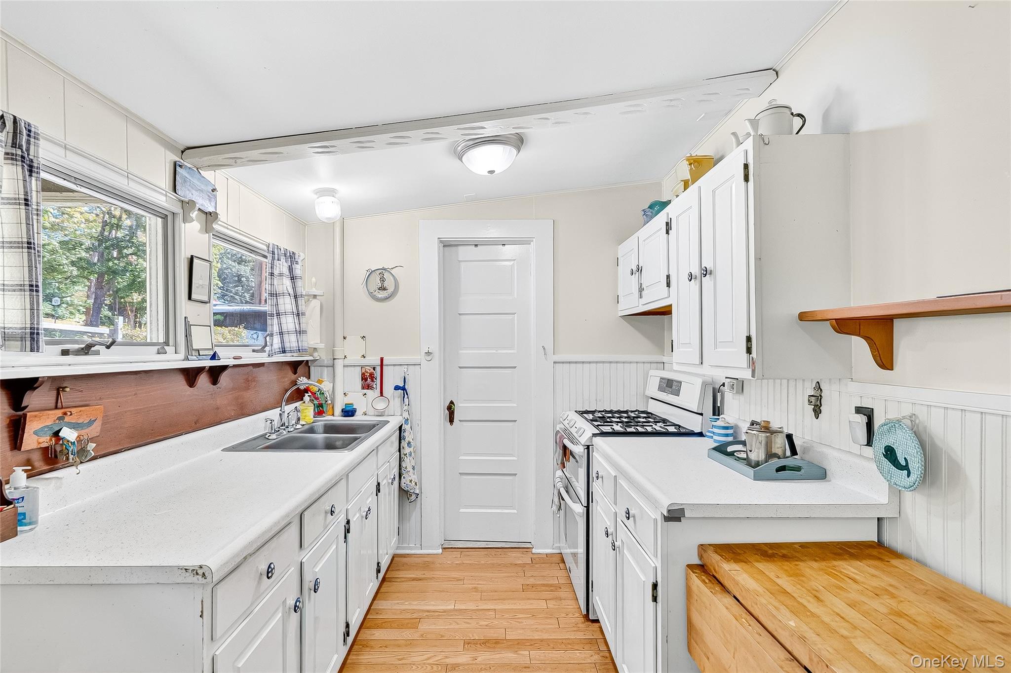 5 Orchard Road North Salem, NY 10509 - Photo 12 of 47 Kitchen with range with two ovens, light wood-type flooring, white cabinets, open shelves, and butcher block countertops
