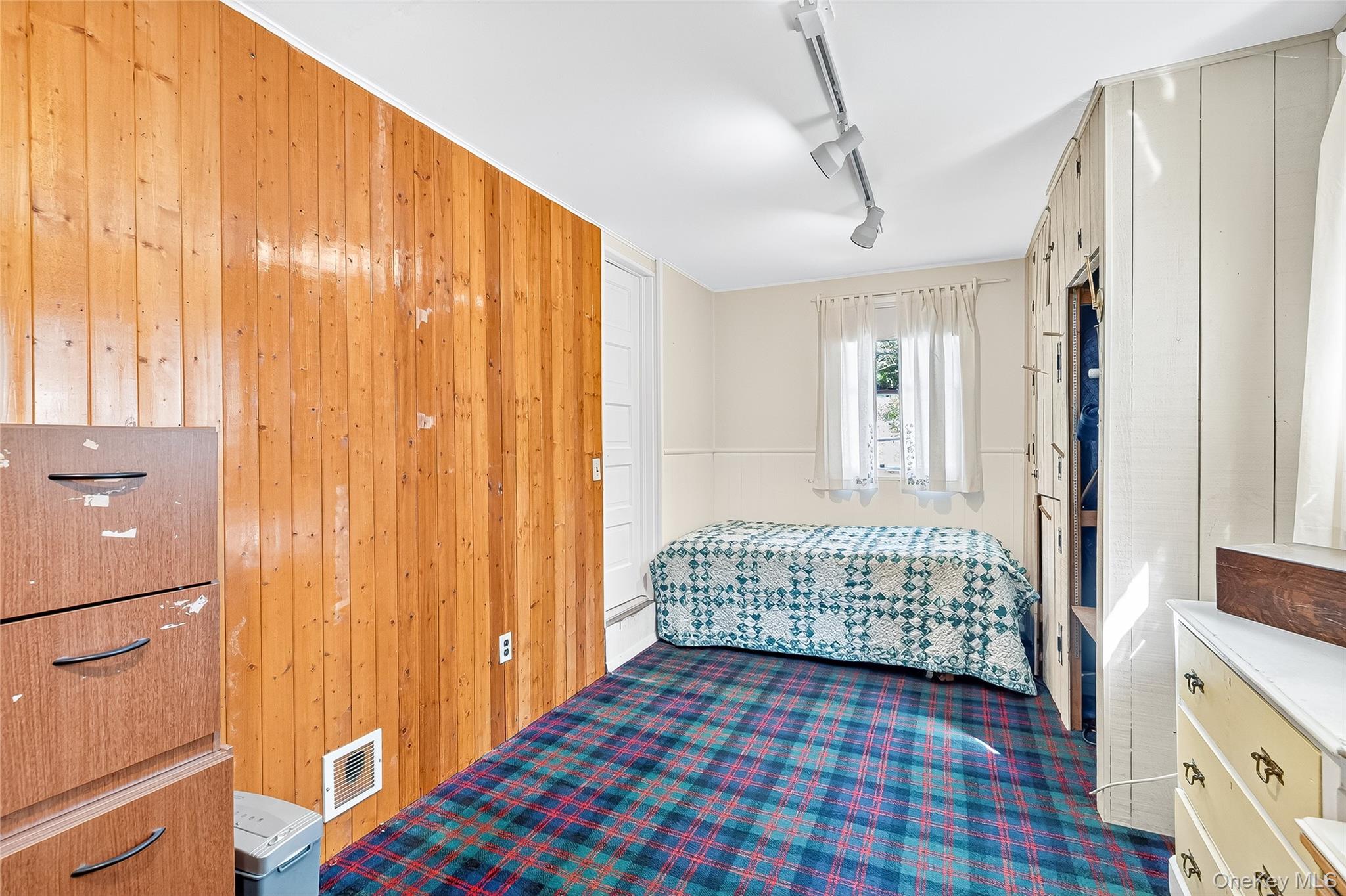 5 Orchard Road North Salem, NY 10509 - Photo 33 of 47 Bedroom featuring wooden walls and track lighting