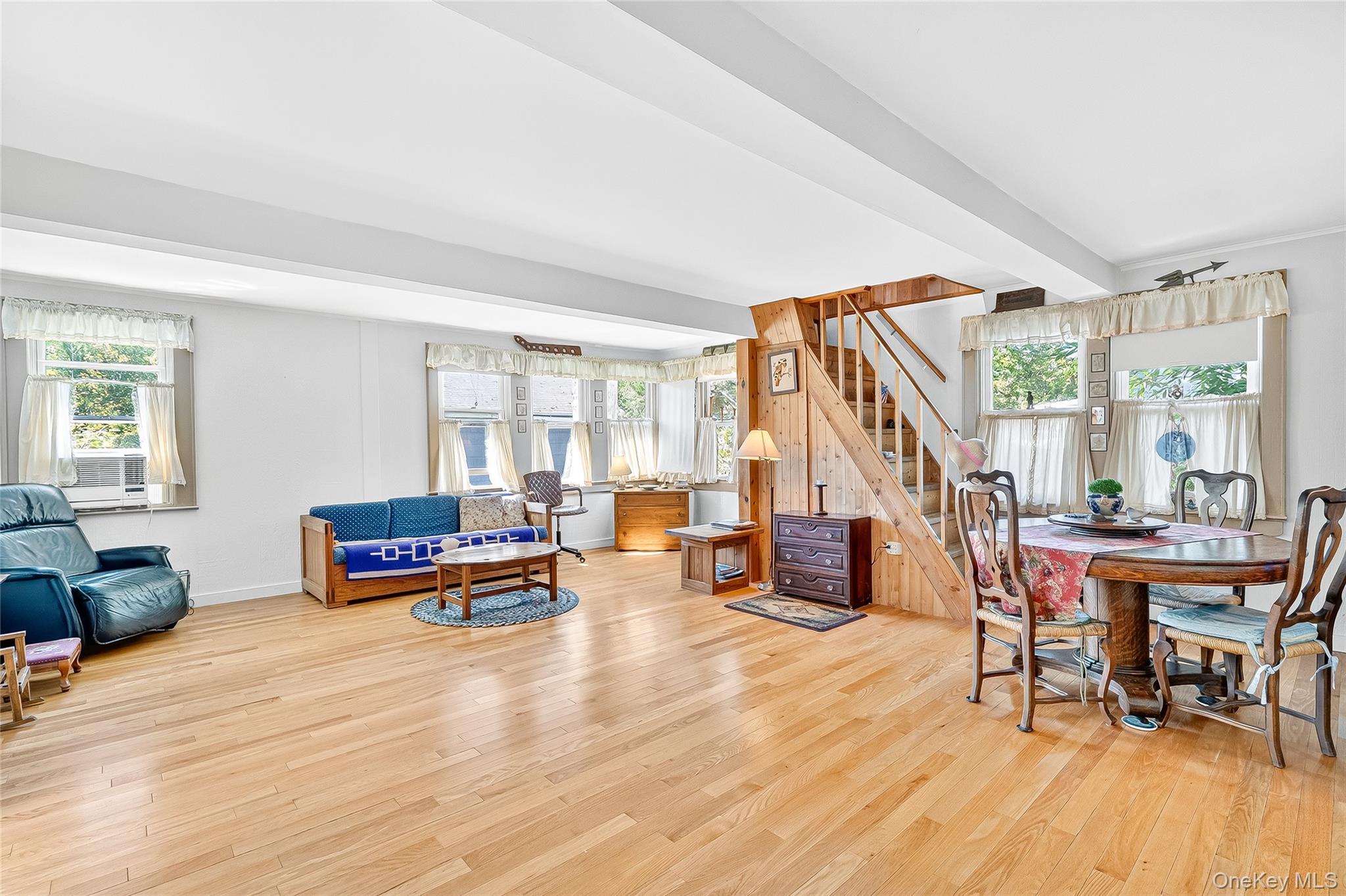 5 Orchard Road North Salem, NY 10509 - Photo 7 of 47 Dining space featuring healthy amount of natural light, stairs, beamed ceiling, and light wood-style flooring