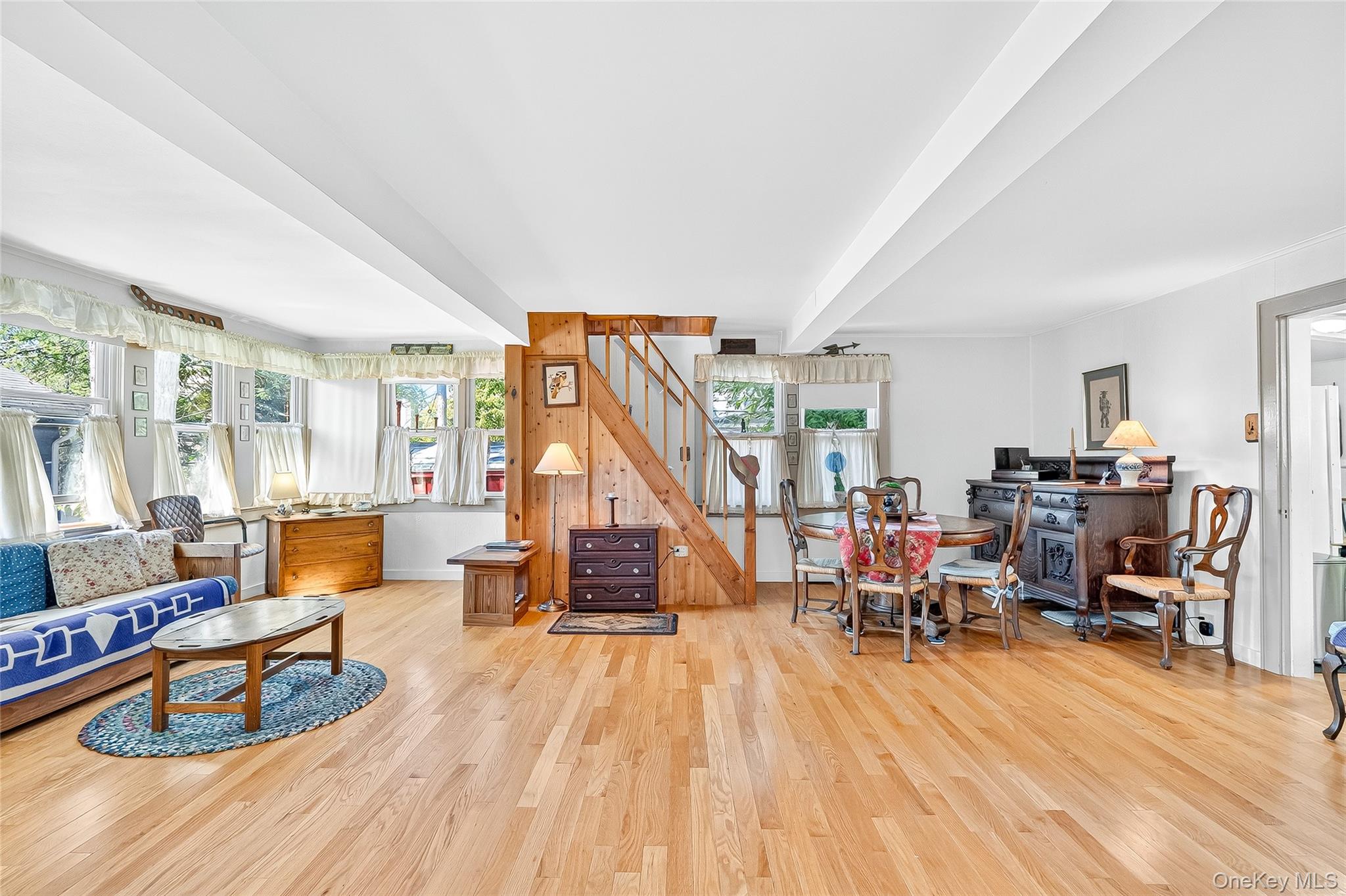 5 Orchard Road North Salem, NY 10509 - Photo 10 of 47 Living room with light wood finished floors, beam ceiling, and stairs