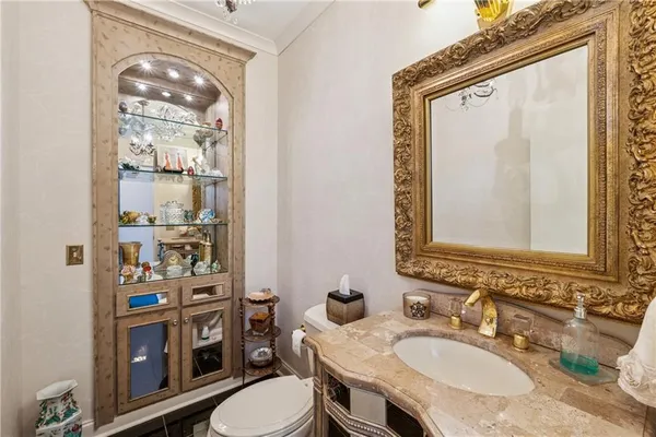 a living room with lots of furniture and a large window