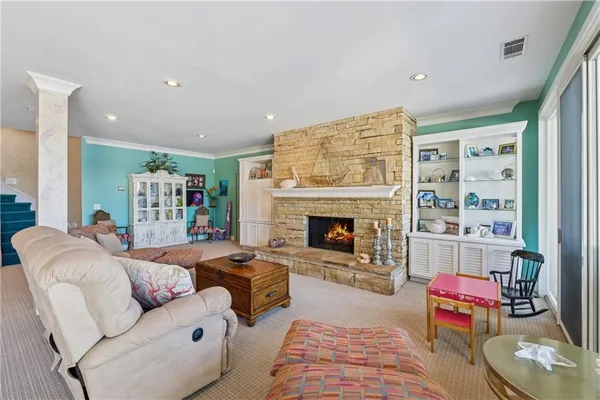 a view of a house with sitting area and swimming pool
