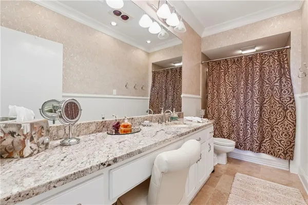 a front view of a house with a garden and patio