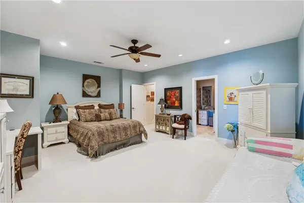 a front view of a house with swimming pool and a yard