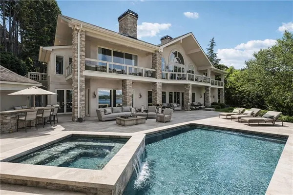 a view of a swimming pool with a lounge chair