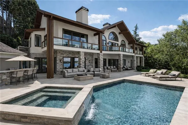 an aerial view of a house with a lake view