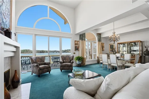 a view of a dining room with furniture large windows and wooden floor