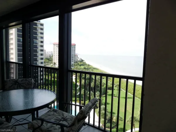 a view of a chairs and table in patio