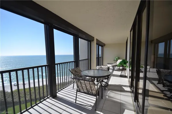 a view of a balcony with furniture
