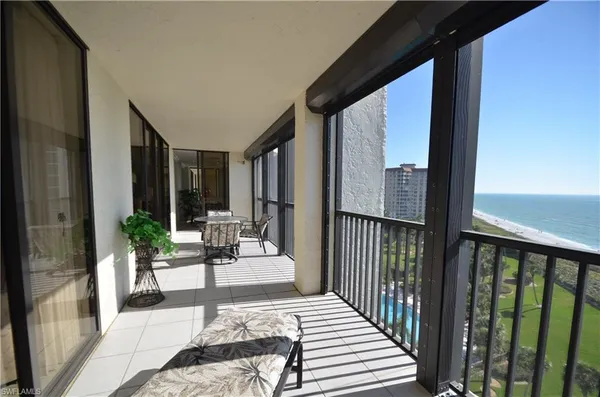 a view of a balcony with chairs