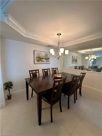 a large kitchen with a table and chairs