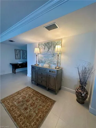 a living room with hard wood flooring and a couch