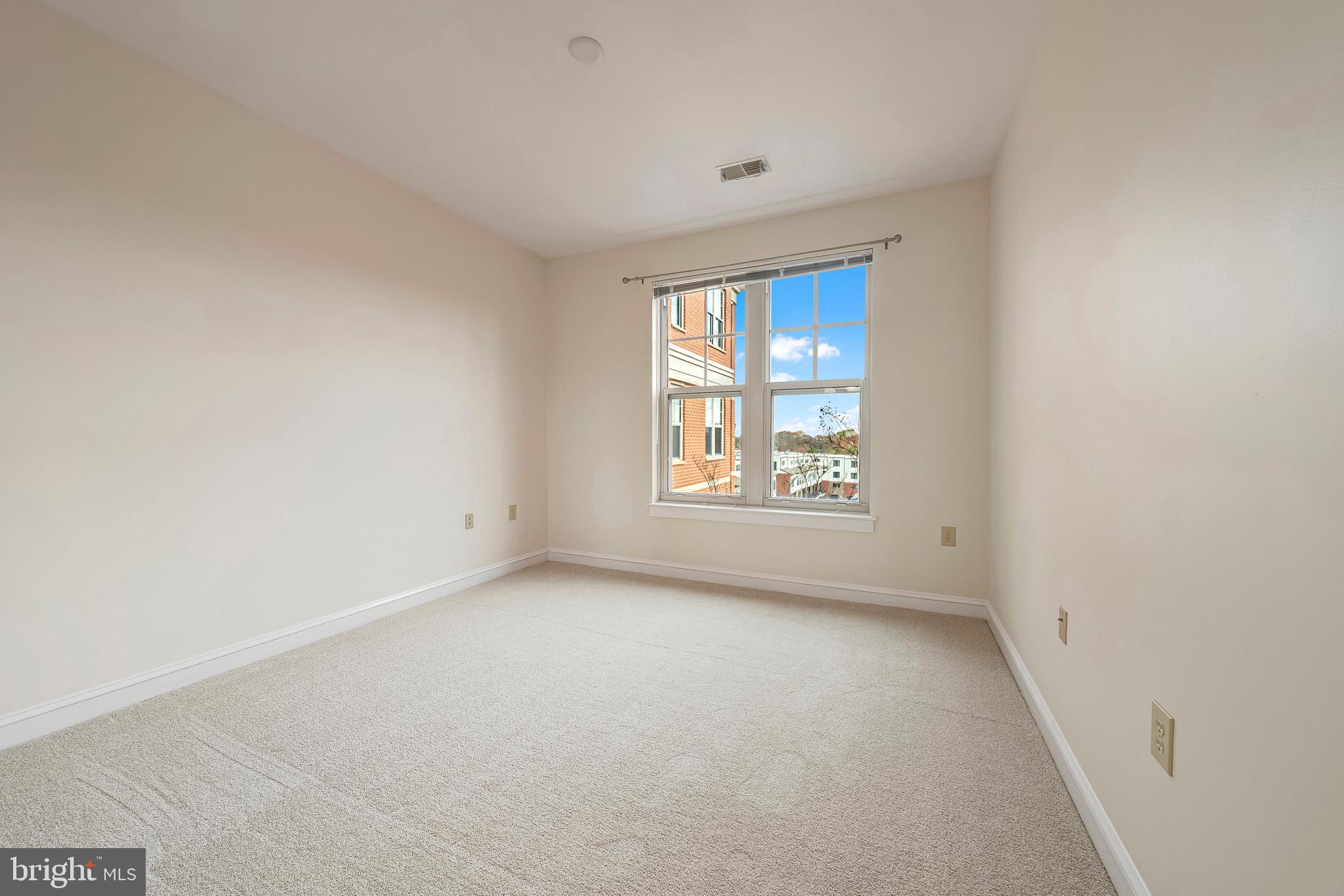 11770 Sunrise Valley Drive, Unit 321 Reston, VA 20191 - Photo 13 of 36 an empty room with windows
