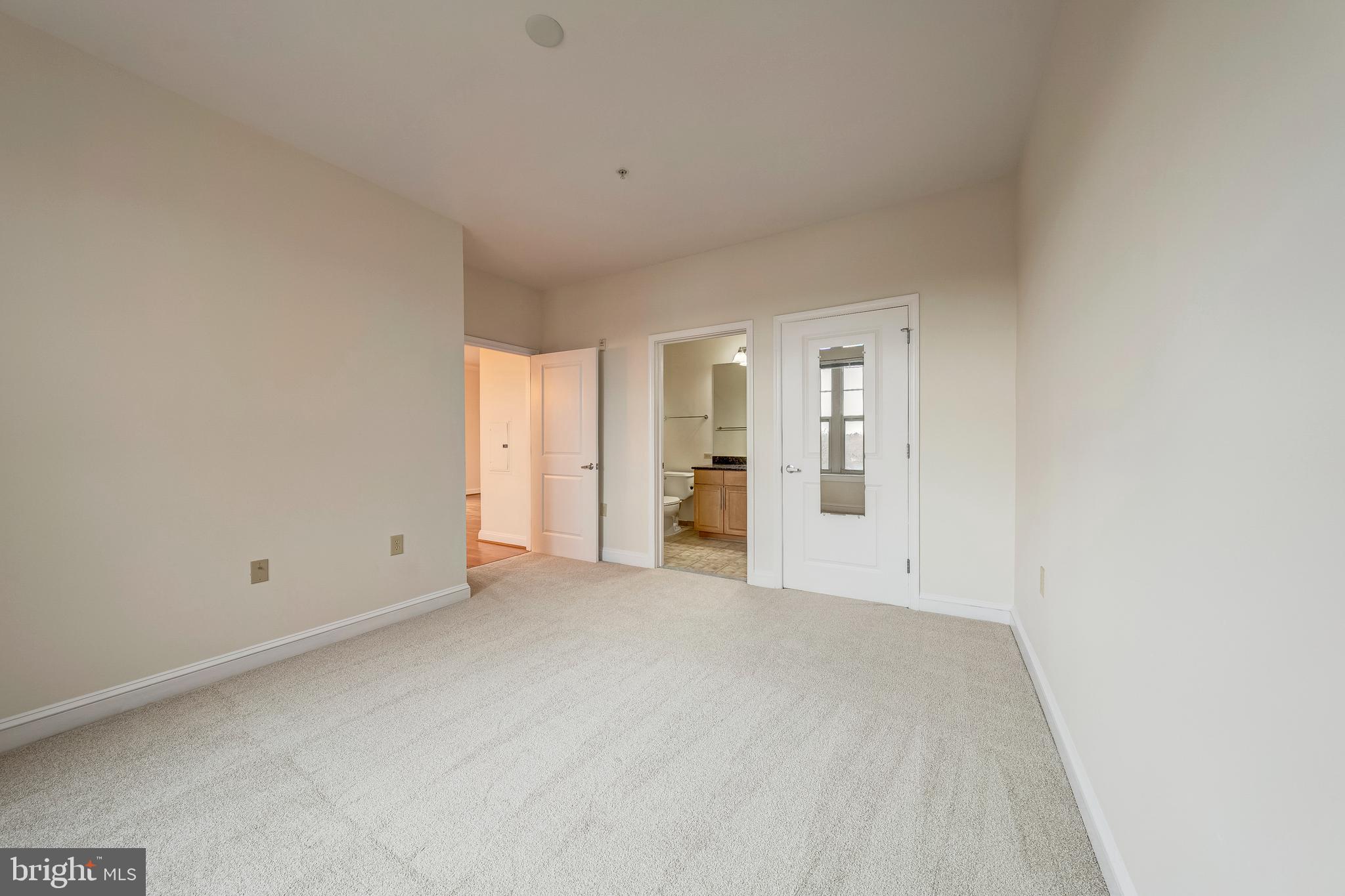 11770 Sunrise Valley Drive, Unit 321 Reston, VA 20191 - Photo 14 of 36 a view of an empty room with a window