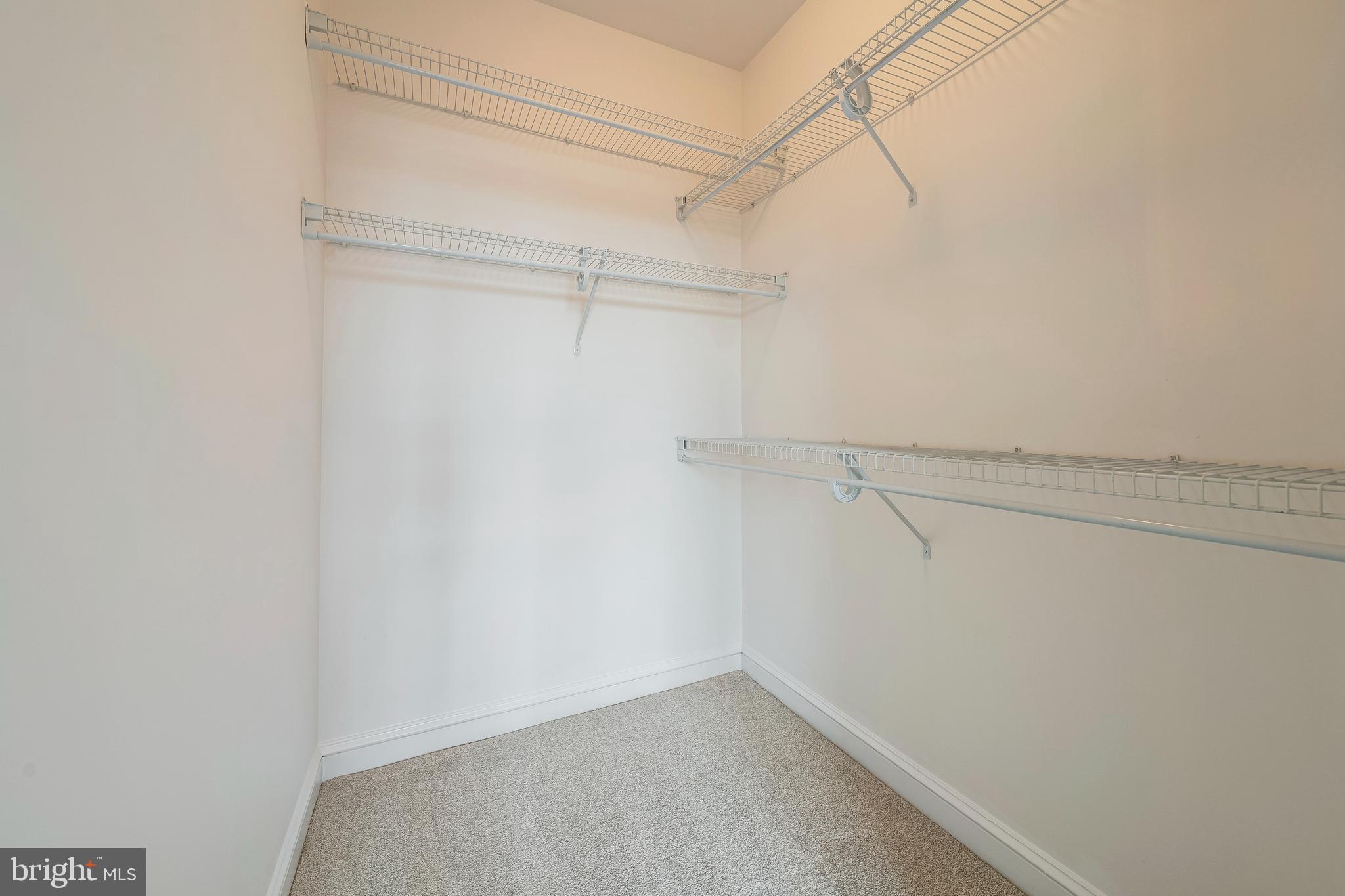 11770 Sunrise Valley Drive, Unit 321 Reston, VA 20191 - Photo 15 of 36 a view of a room with racks on the wall