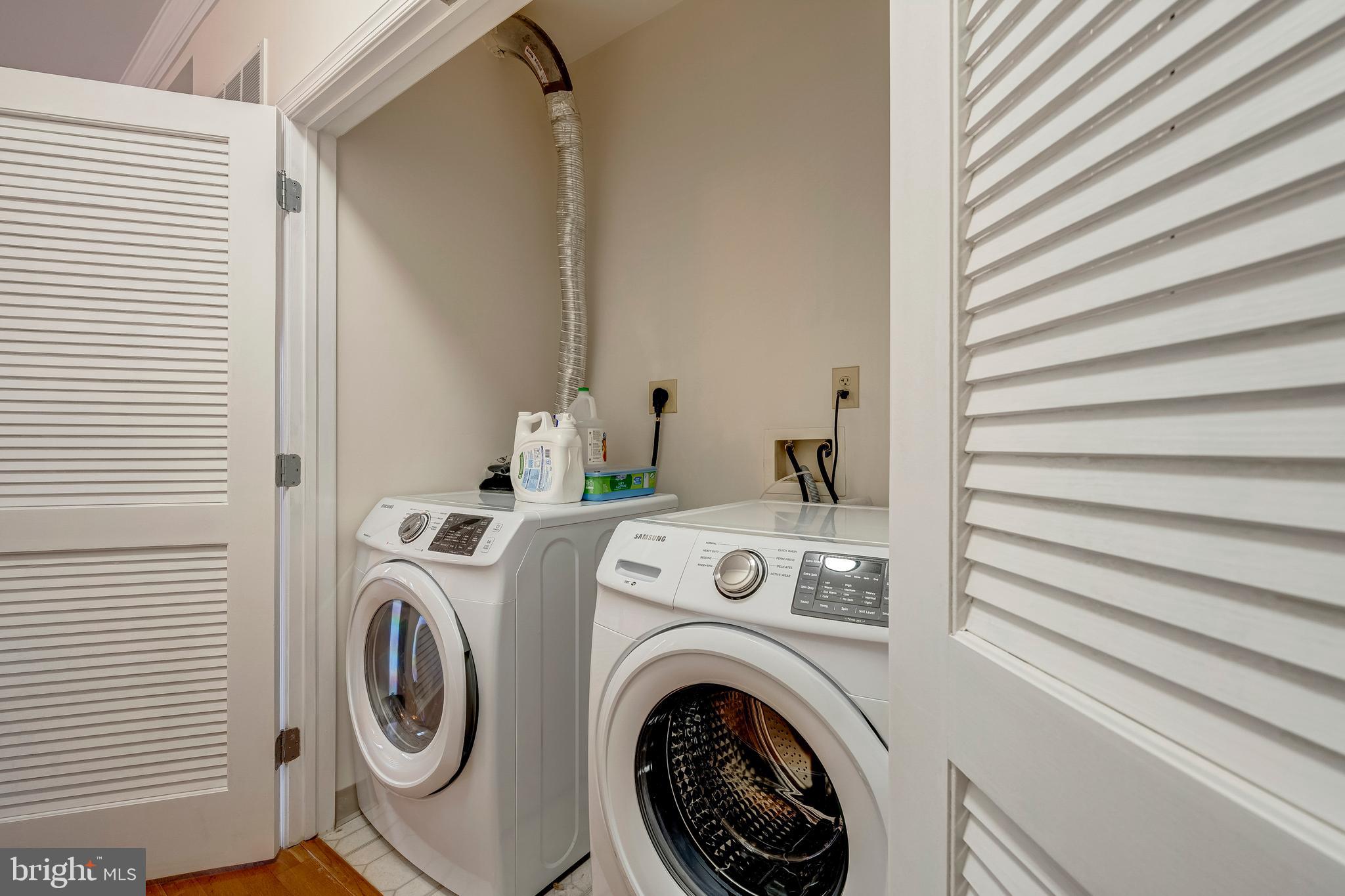 11770 Sunrise Valley Drive, Unit 321 Reston, VA 20191 - Photo 21 of 36 a utility room with dryer and washer