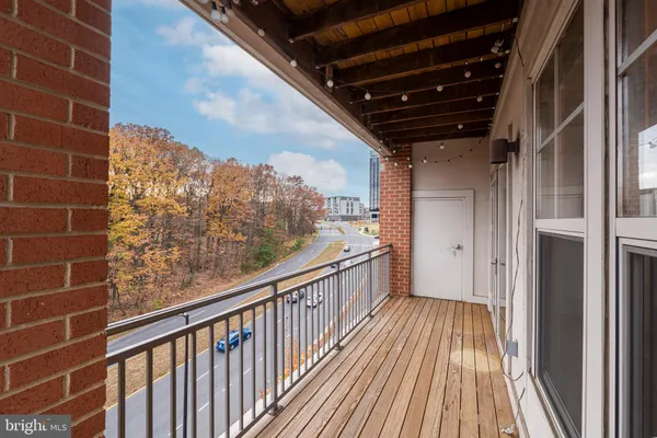 a view of balcony with wooden floor
