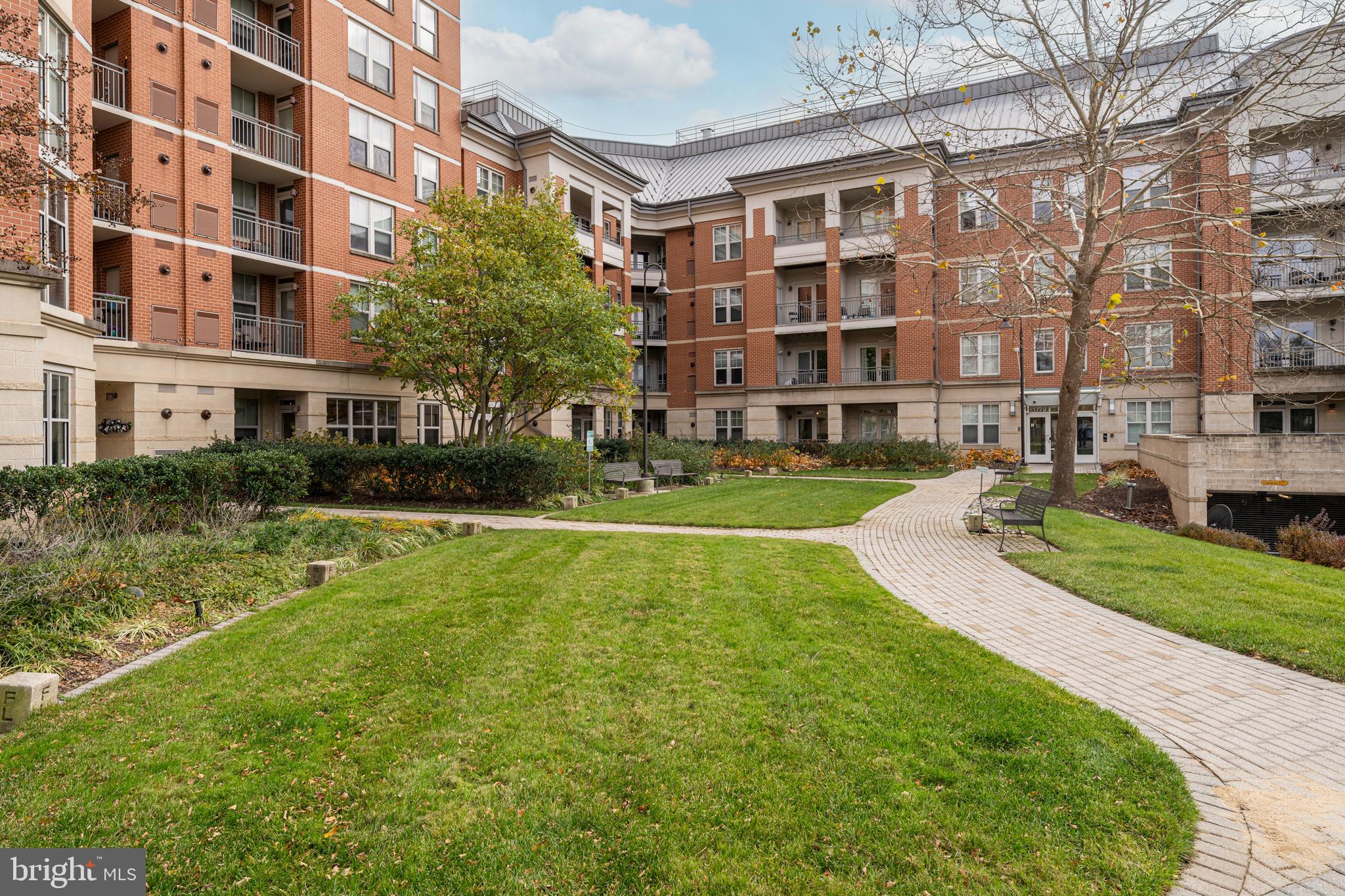 11770 Sunrise Valley Drive, Unit 321 Reston, VA 20191 - Photo 25 of 36 a view of a building with garden