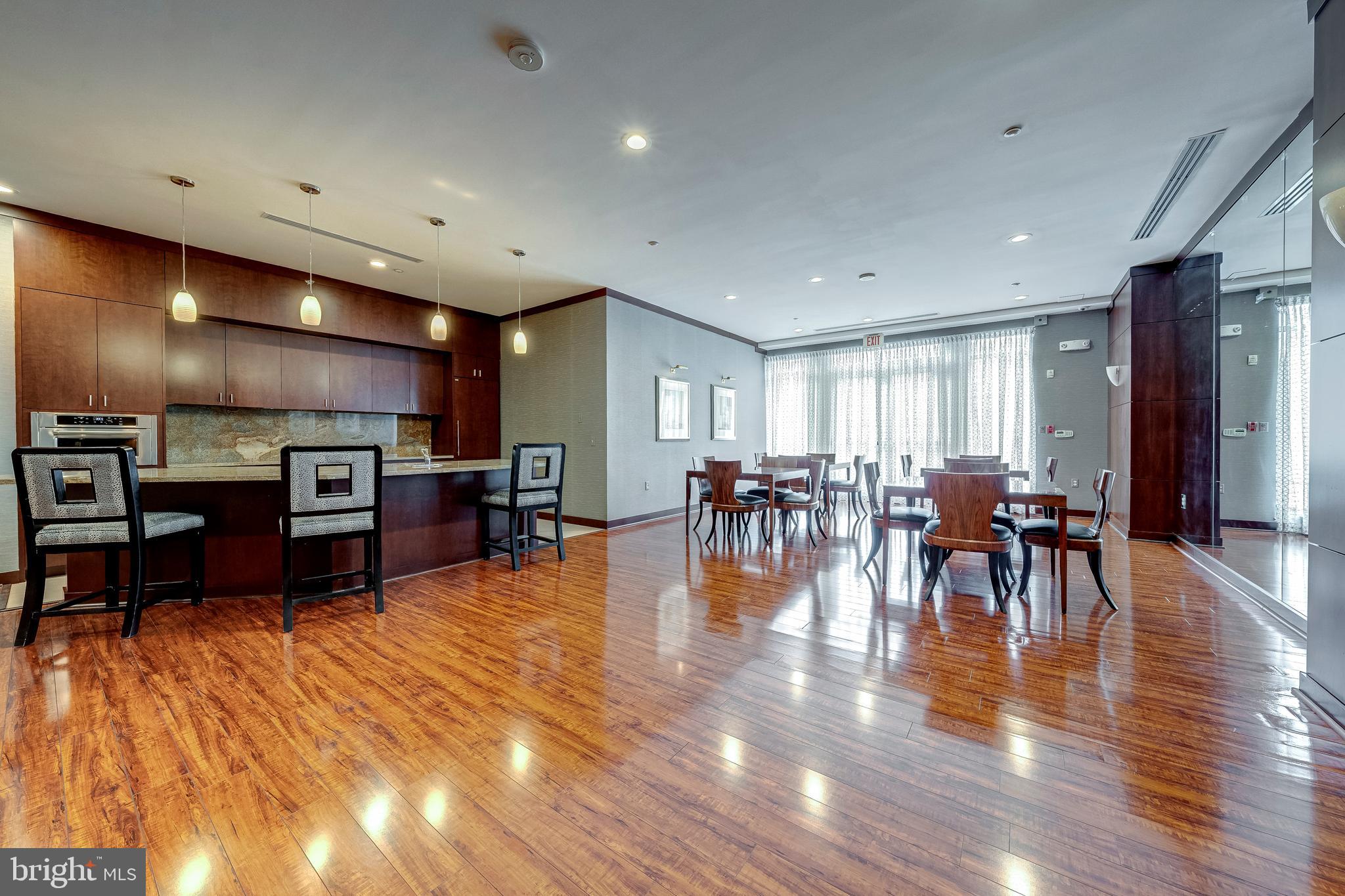 11770 Sunrise Valley Drive, Unit 321 Reston, VA 20191 - Photo 28 of 36 a lobby with furniture and wooden floor