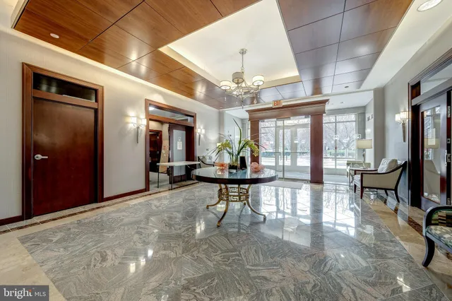 a living room with furniture a window and ceiling fan