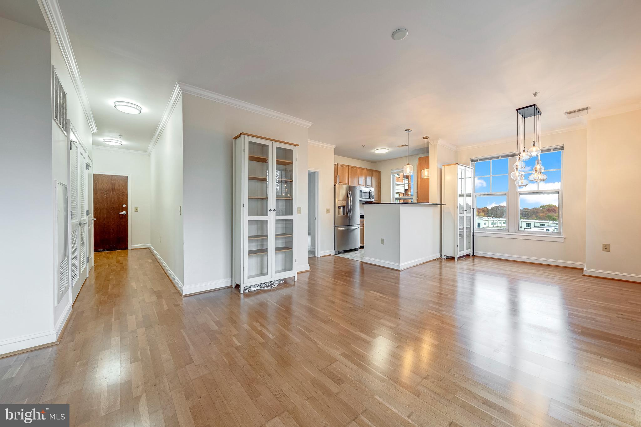 11770 Sunrise Valley Drive, Unit 321 Reston, VA 20191 - Photo 6 of 36 a view of a kitchen with wooden floor and a kitchen